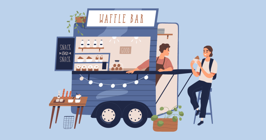 Person serving waffles at waffle cart.